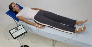 Image of woman with electrodes attached for Bioelectrical impedance analysis